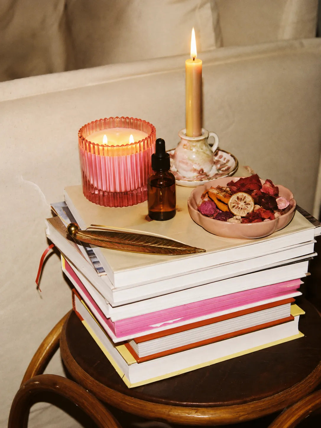 Cream-colored textured ceramic reed diffuser with wooden base in Home Fragrance