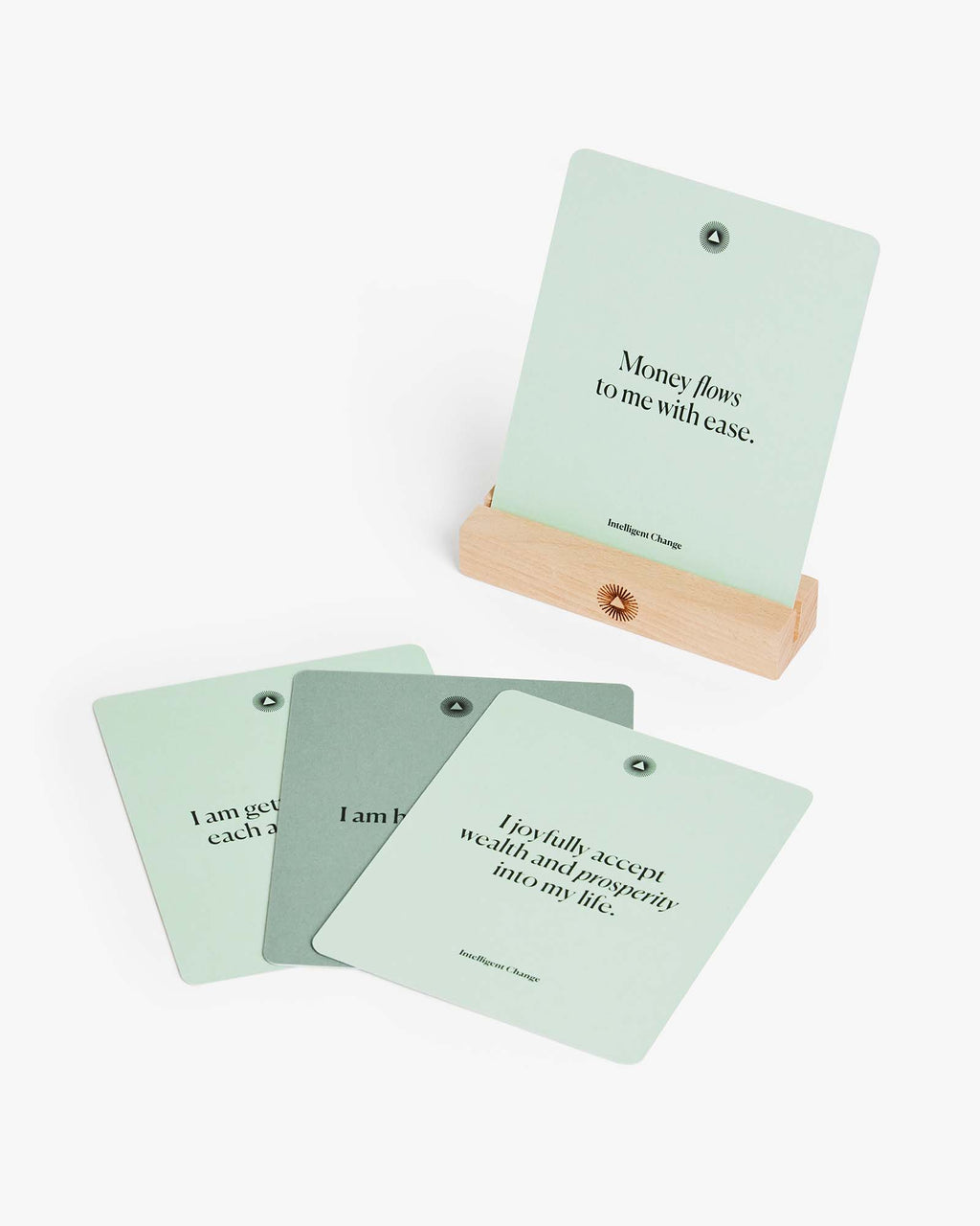 Affirmation cards displayed on the beechwood stand with extra cards beside them.
