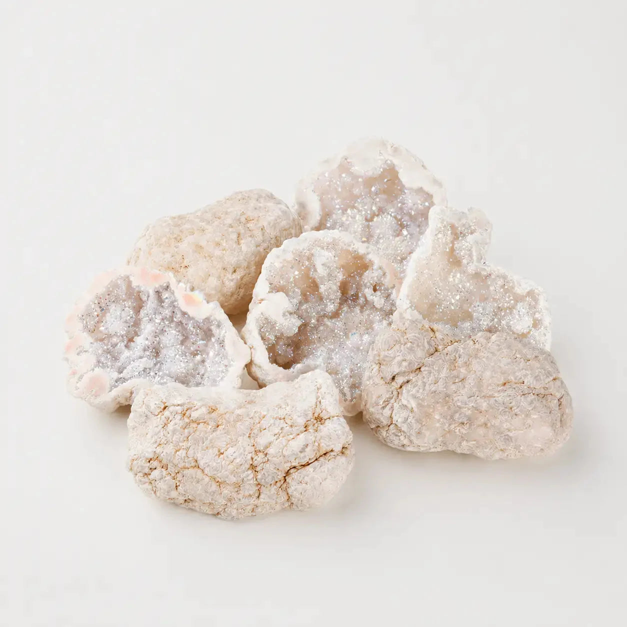 LumaStone natural hollow white agate crystal geode freeform crystal decor with electroplated sparkly interiors.