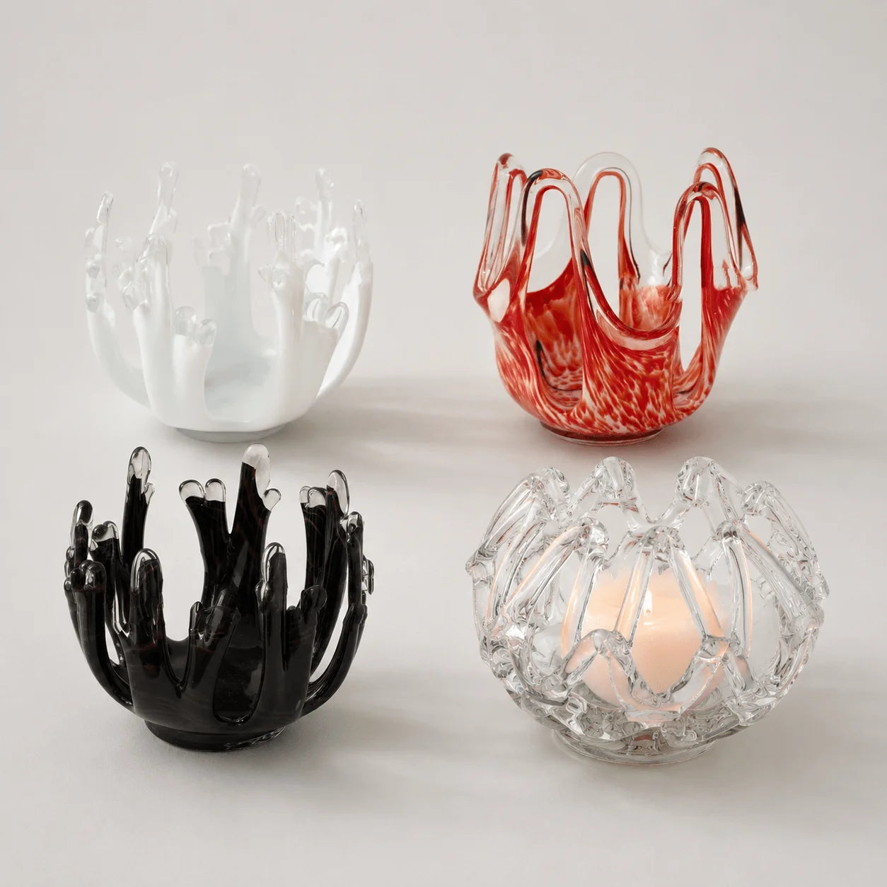 StillAura glass lotus candle holder, a beautiful home fragrance accessory for elegant decor.