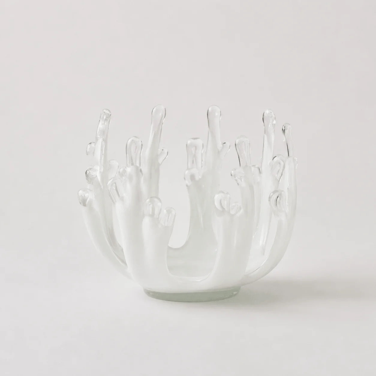 StillAura glass lotus candle holder; an elegant clear glass candlestick home fragrance accessory.