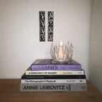 StillAura glass lotus candle holder; elegant home fragrance accessory, perfect for candles.