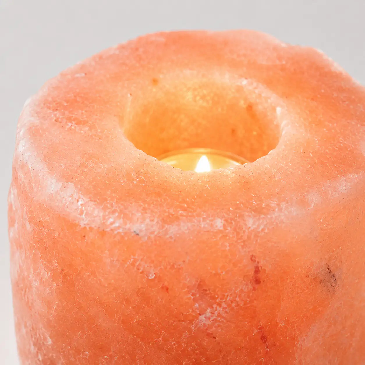 LumaStone rose mineral salt crystal healing candle holder with a glowing tea light, perfect decorative home decor.