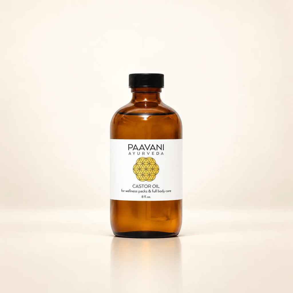 Paavani Ayurveda castor oil in an amber glass bottle