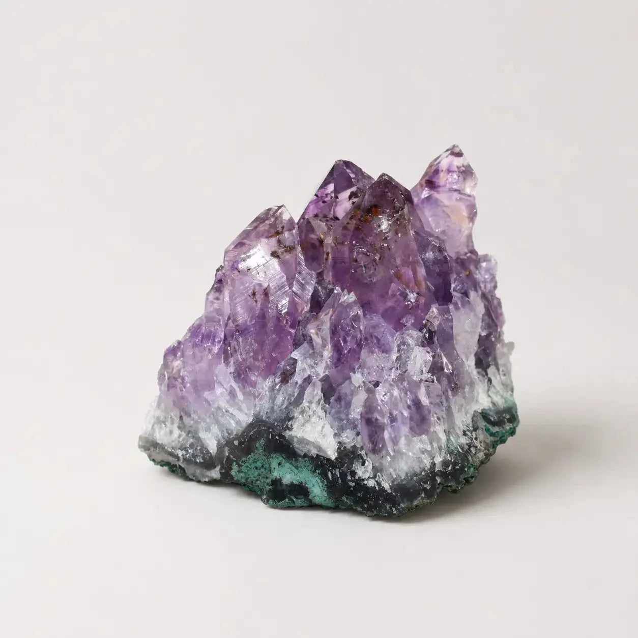 LumaStone Amethyst Raw Crystal Cluster, a natural purple decorative stone with multiple pointed facets and a dark gre...