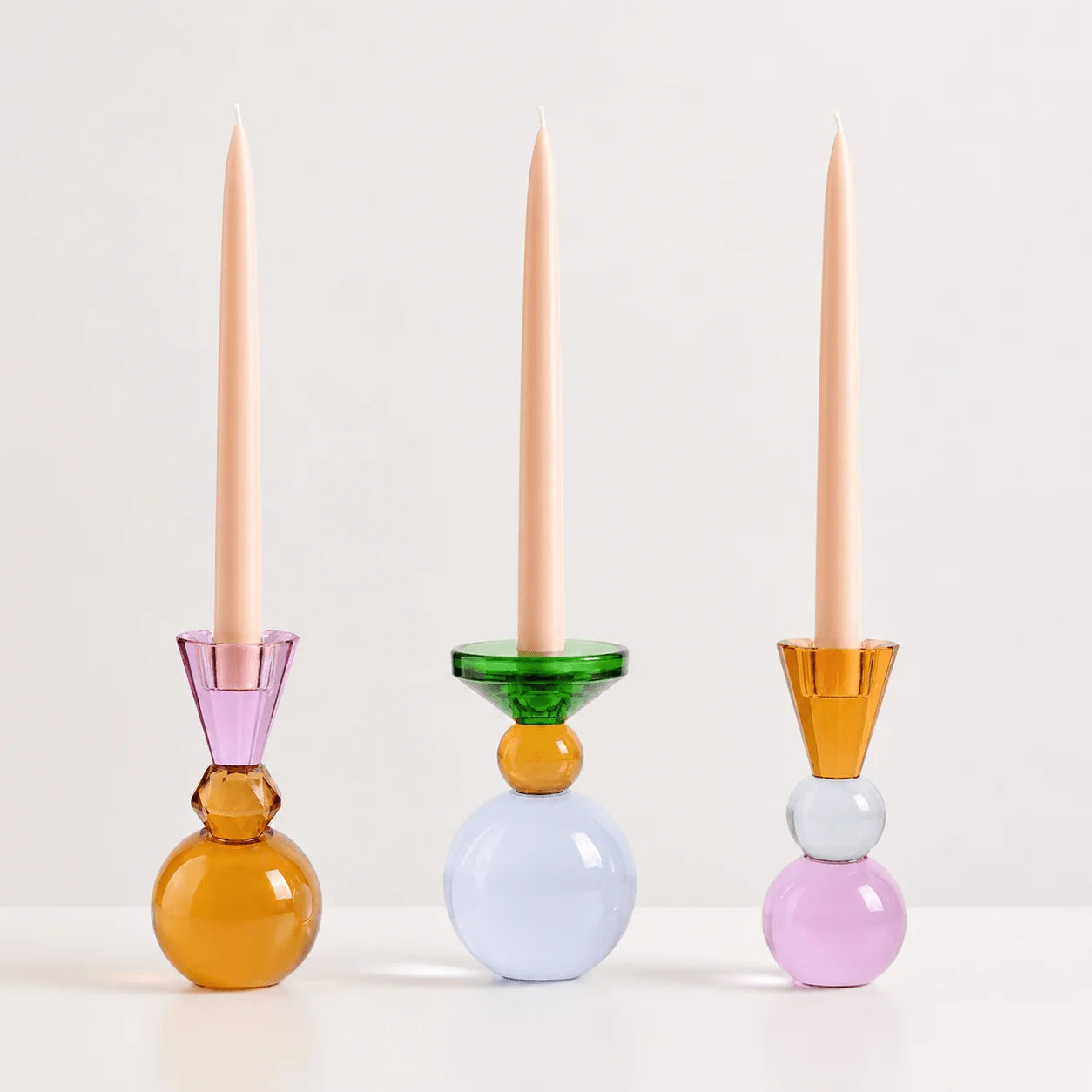 StillAura crystal multicolored candle holders, European block cup candle decor on white surface.