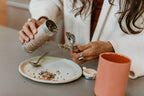 Loose-leaf herbs from Paavani Ayurveda Women’s Blend being poured