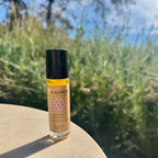 Women’s Moon Oil roll-on bottle photographed outdoors