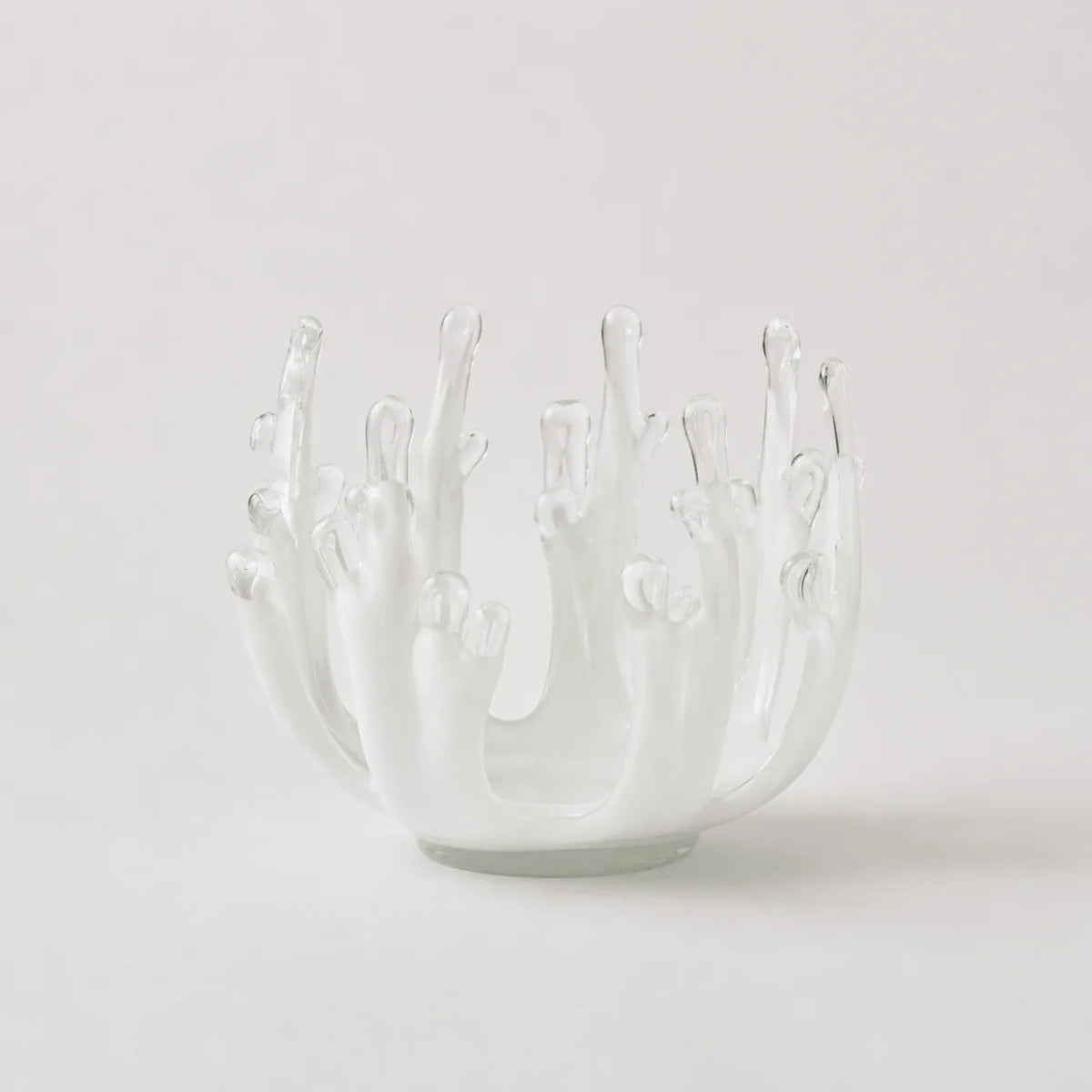 StillAura glass lotus candle holder; an elegant clear glass candlestick home fragrance accessory.