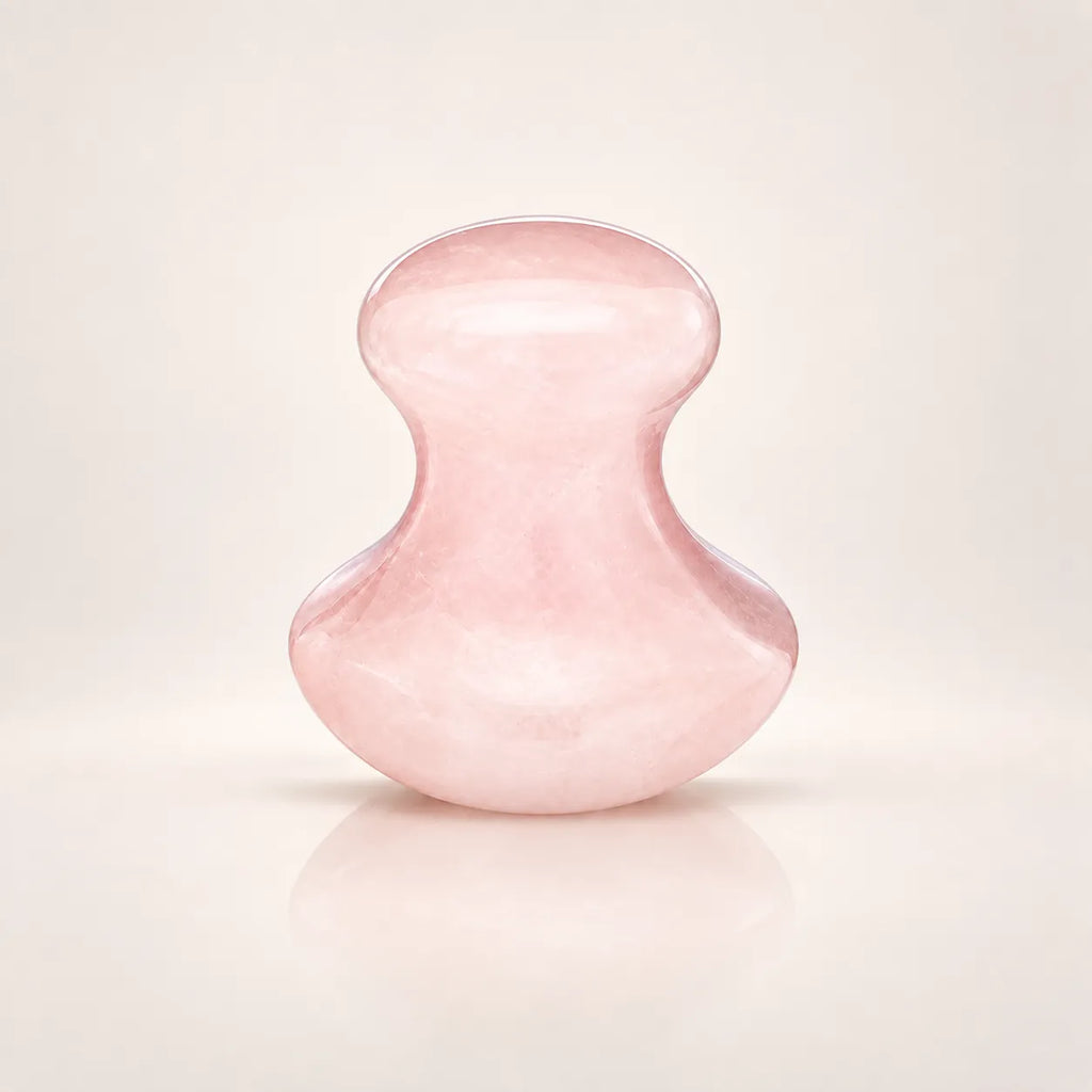 Rose quartz facial massage tool shown alone