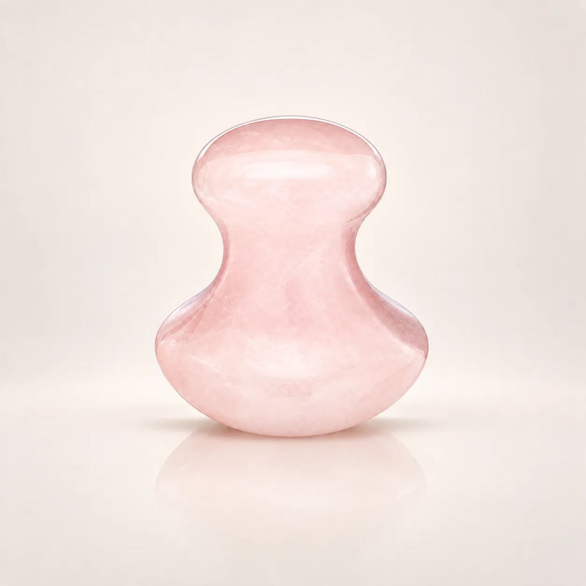 Rose quartz facial massage tool shown alone