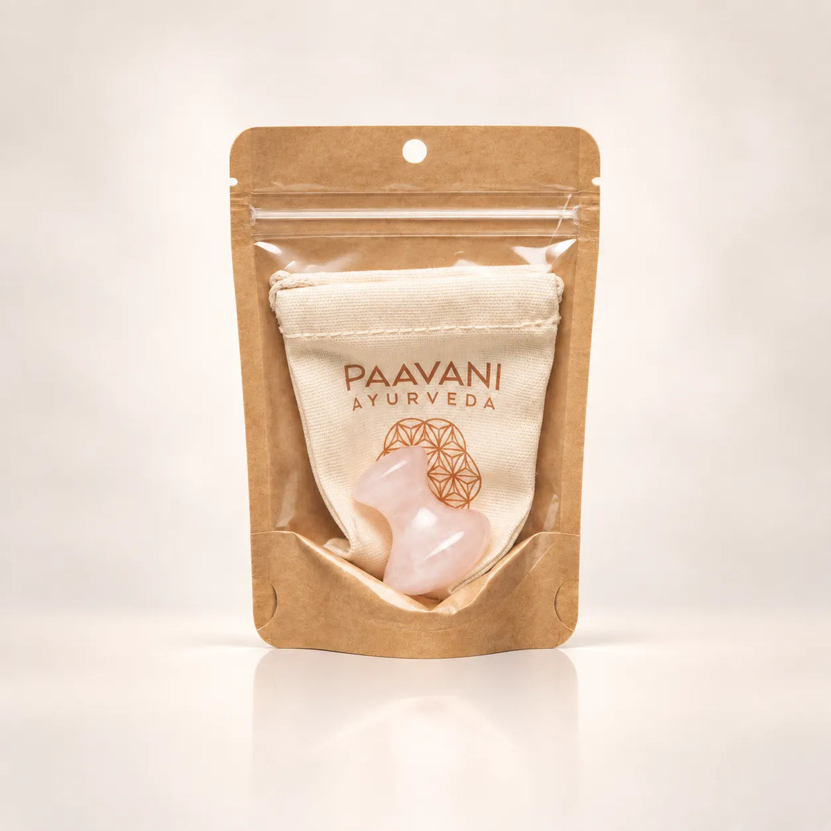 Rose quartz facial massage tool with included cloth drawstring pouch