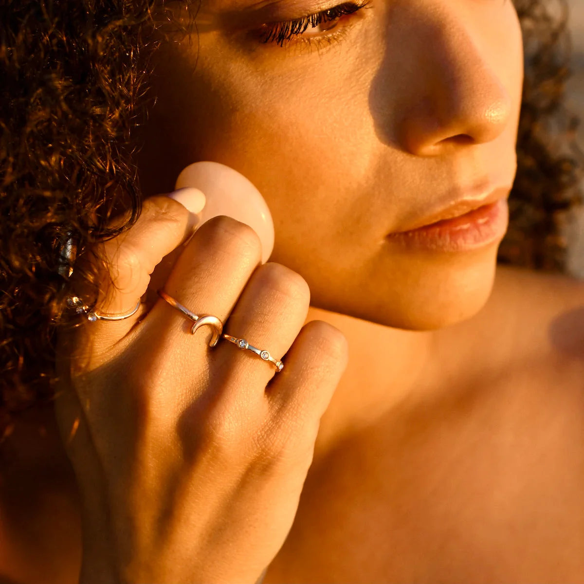 Rose quartz facial massage tool used in a facial massage demonstration