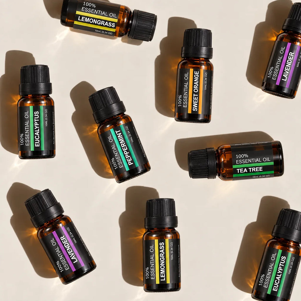Six StillAura aromatherapy oil bottles arranged around their presentation box.