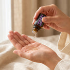 Lavender essential oil being poured into the palm