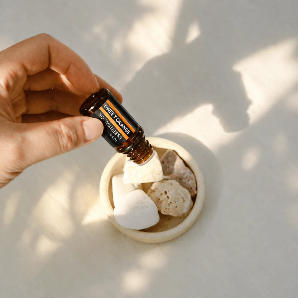 Sweet orange essential oil used with aroma stones