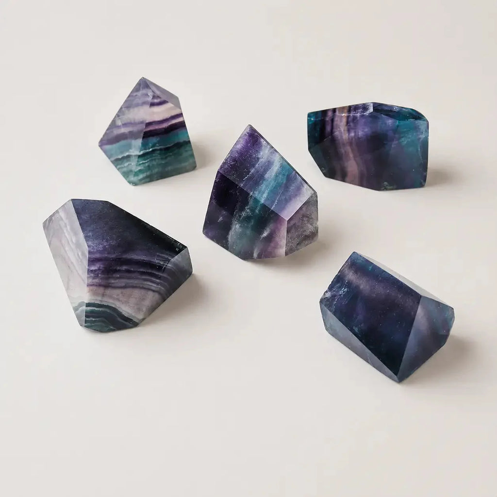 LumaStone Rainbow Fluorite polished crystal polyhedron ornament with vibrant green and purple hues, perfect for natur...