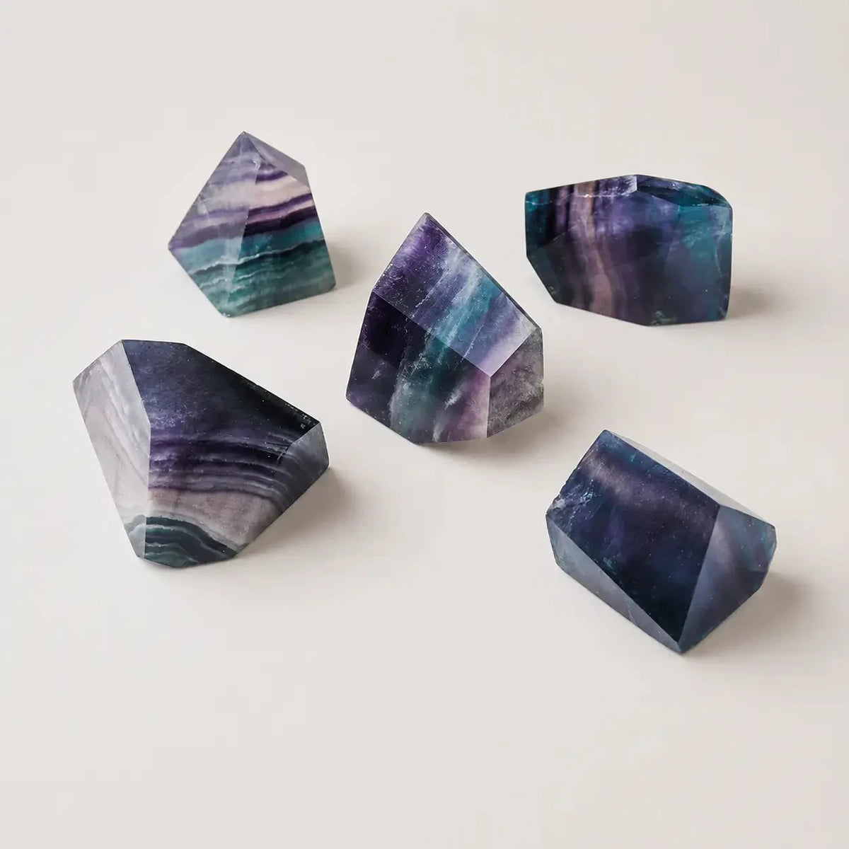 LumaStone Rainbow Fluorite polished crystal polyhedron ornament with vibrant green and purple hues, perfect for natur...