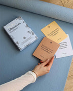 Chakra affirmation cards during a yoga and fitness practice