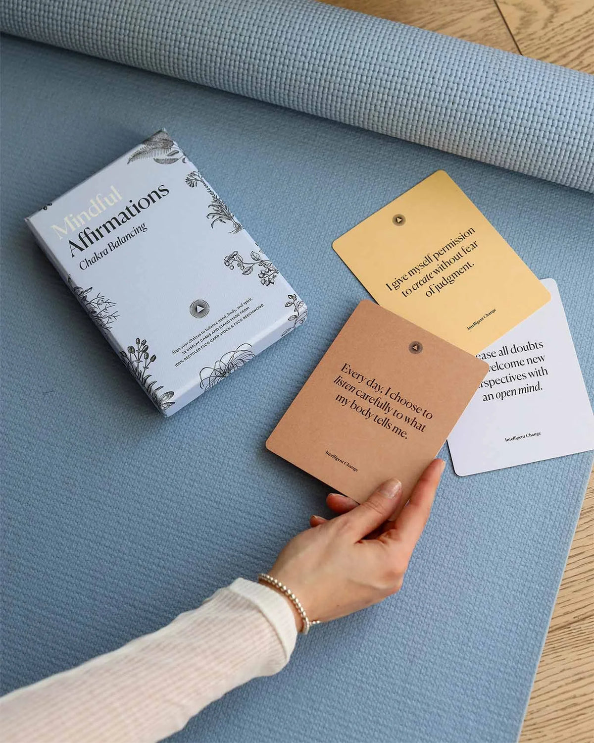 Chakra affirmation cards during a yoga and fitness practice