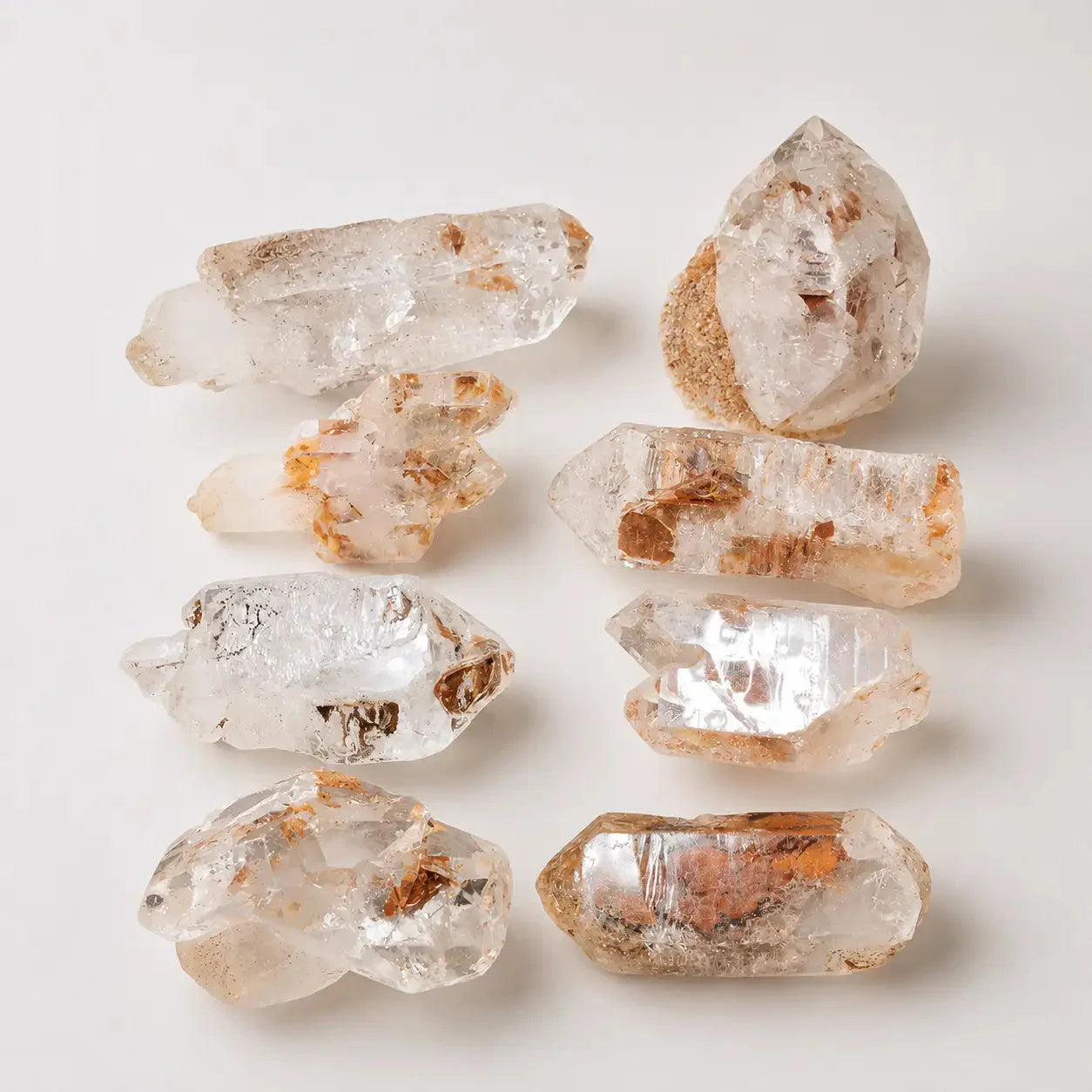 LumaStone natural white crystal rough stone, a raw geometric crystal for decorative display or keychain.