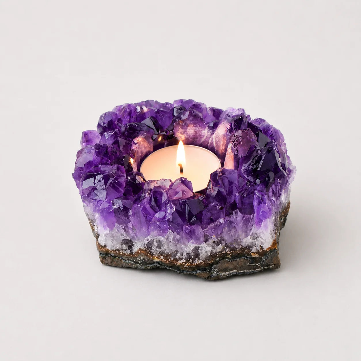 LumaStone natural amethyst cluster candle holder, unique crystal decor ornament for a warm glow.