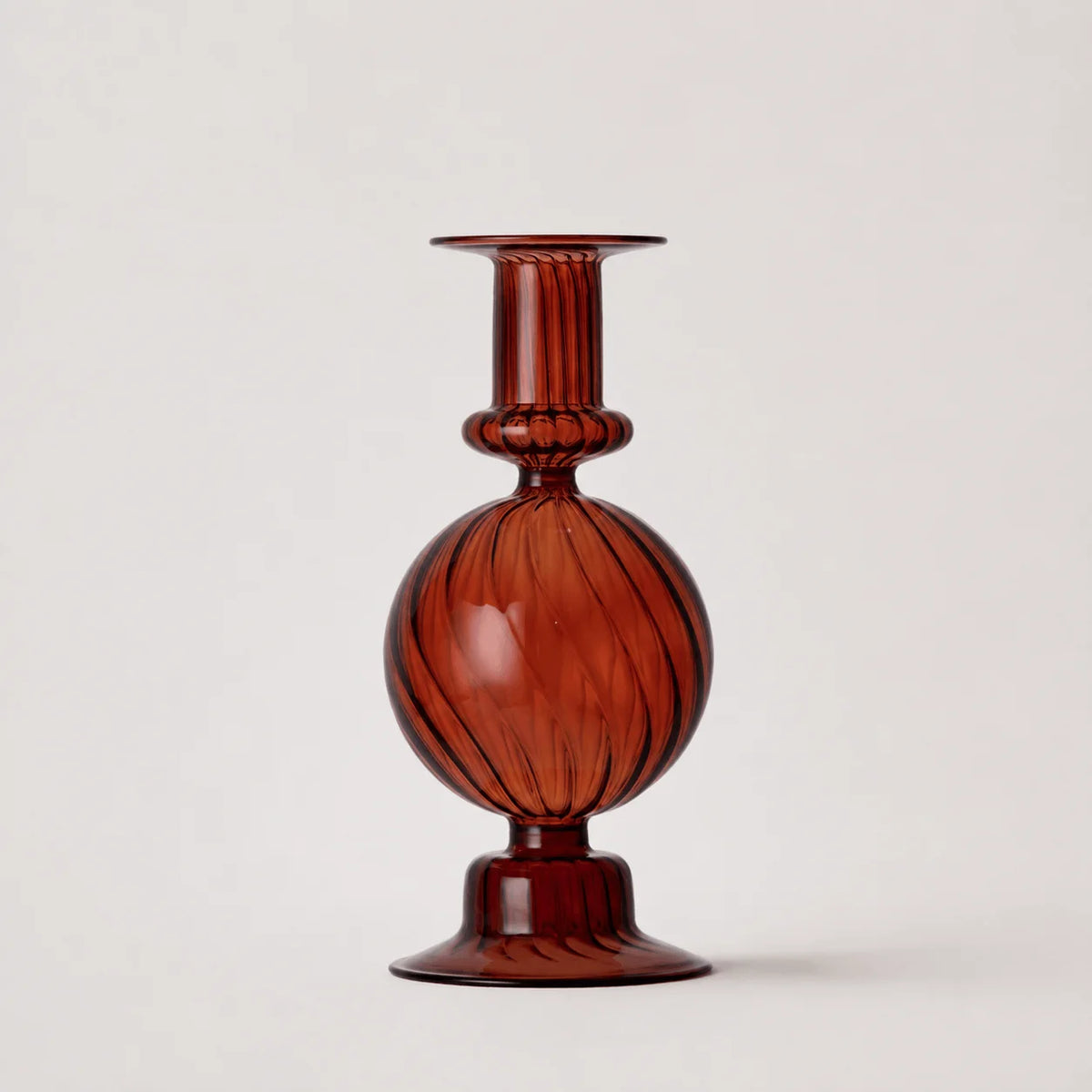 StillAura borosilicate glass candle holder, clear decorative candlestick for home decor, side angle view.