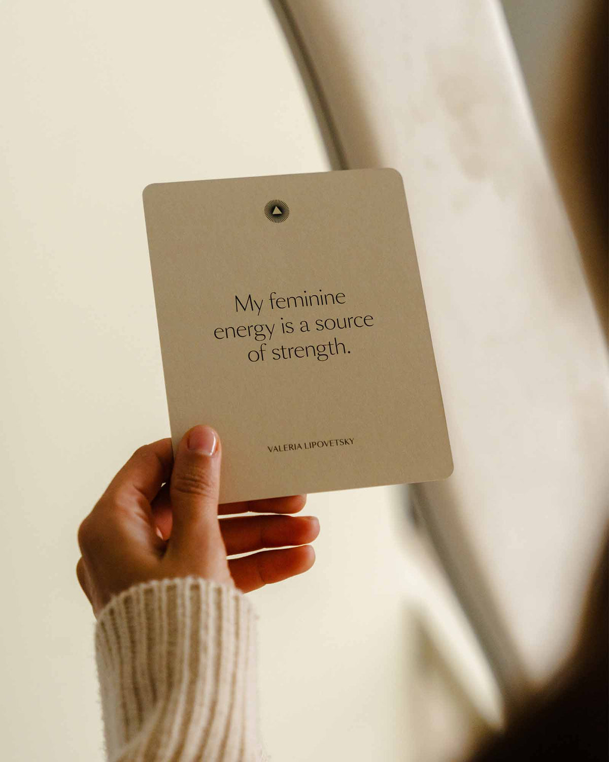 Intelligent Change Mindful Affirmations for Women card held near a window