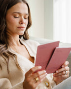 Woman reading Intelligent Change Mindful Affirmations for Women cards