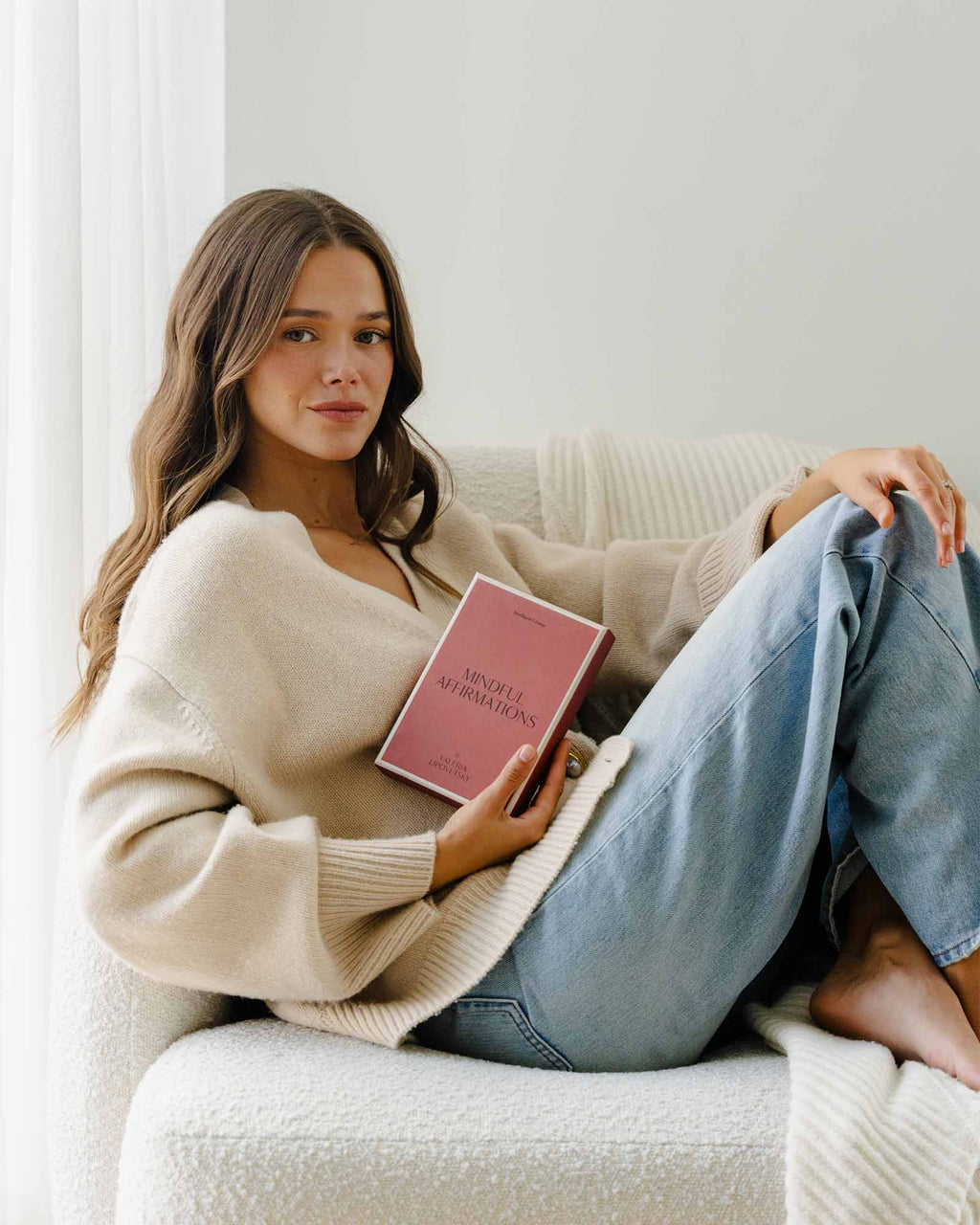 Woman holding Intelligent Change Mindful Affirmations for Women box