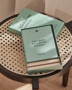 Mindful Affirmations for Financial Abundance open box and cards in a lifestyle setting.