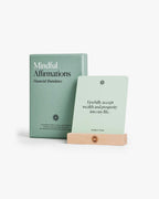 Mindful Affirmations for Financial Abundance box, sample card, and beechwood stand on a light background.